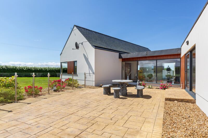 The property has an extensive patio and has a barbecue area