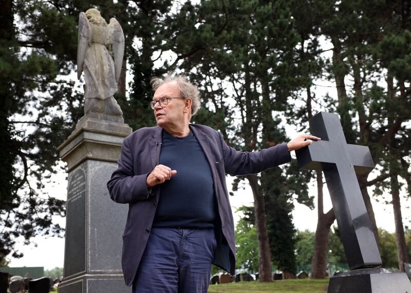 Historian Tom Hartley in Milltown Cemetery, Belfast in 2023. Photograph: Stephen Davison
