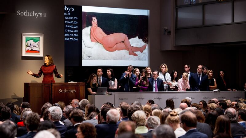 The auction of Modigliani’s   ‘Nu Couche (sur le cote gauche)’  at the Modern Art Auction at Sothebys auction house. Photograph:  EPA