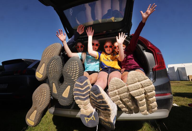 Children from Straffard GAA Club in Co Kildare enjoy the sunshine on the first day of the National Ploughing Championships on Tuesday. Photograph: Alan Betson/The Irish Times

