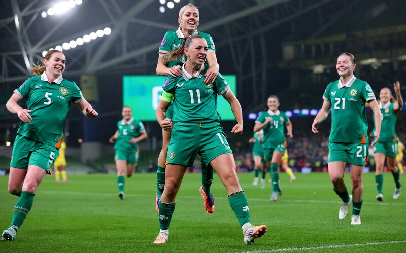 Katie McCabe celebrates scoring her second goal with Denise O’Sullivan. Photograph: Ryan Byrne/Inpho