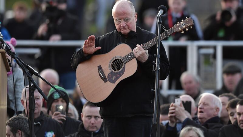 Singer-songwriter Christy Moore performs a tribute to  Martin McGuinness at Derry’s City Cemetery. Photograph: Charles McQuillan/Getty Images