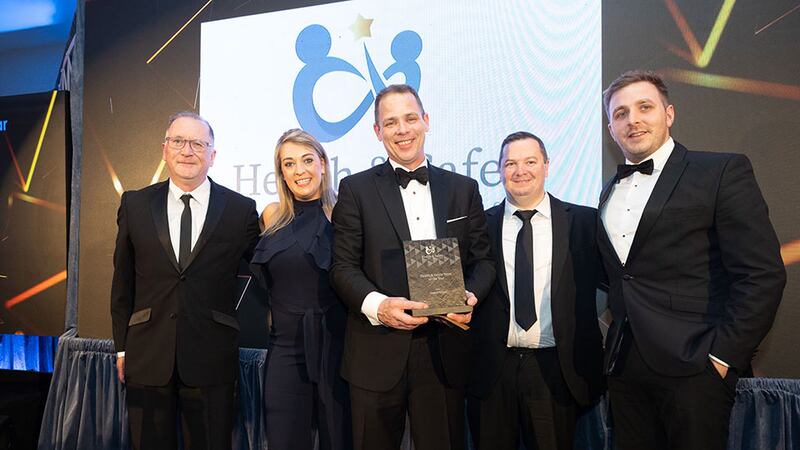 Coleman Yates, deputy managing director at Bretland presents the health & safety team of the year to Sodexo Ireland team