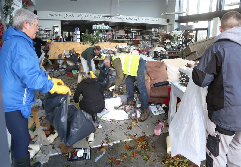 Saff and locals clear out the Meadows and Byrne department store in Clarenbridge. Photograph: Joe O'Shaughnessy