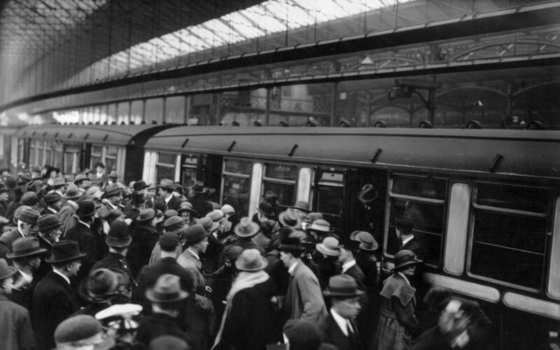 May 1923: Irish  people being deported in connection with IRA activities board trains at London’s Waterloo station. Photograph: Topical Press Agency/Getty Images