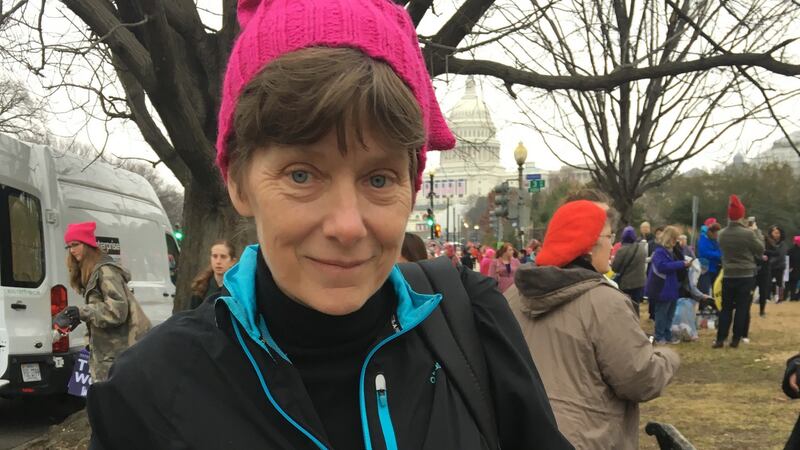 Carrie McKnight, from Virginia, who handed out pink hats to marchers in Washington, with a note and a hat sent from a Bobbi in New Mexico: “Dear Sister, thank you! Wish I could attend but this hat is my contribution.”
