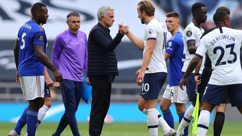 Tottenham manager Jose Mourinho shakes hands with his striker Harry Kane after their win against Leicester City. Photograph: Getty Images