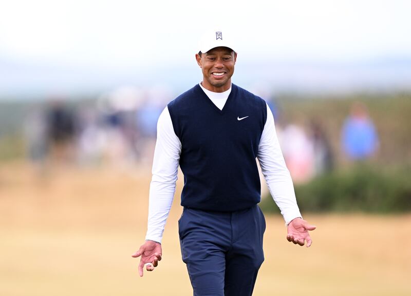 Tiger Woods  reacts on the ninth hole during the first round. Photograph: Ross Kinnaird/Getty Images