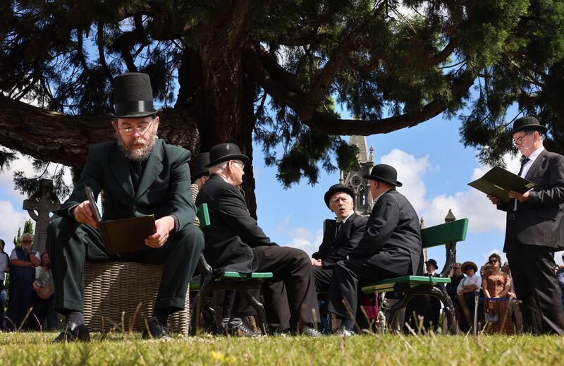 The JoyceStagers from left; Blaise Reid, Paul Maher, Ian Blackmore, Val O'Donnell and Peter Prior, perform The Funeral of Paddy Dignam at Glasnevin Cemetery. Photograph: Dara Mac Dónaill








