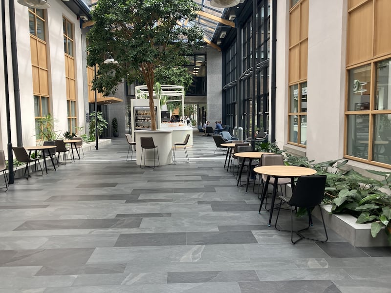 The atrium at 2 Custom House Plaza is home to a Bear Market coffee shop