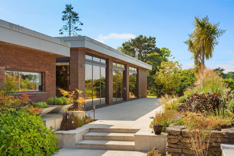 A wraparound terrace is accessed by all reception rooms