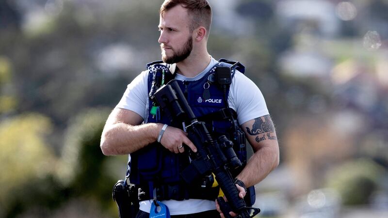 A police officer at the scene of  a shooting incident in  Auckland. Photograph: Greg Bowker/AFP via Getty Images