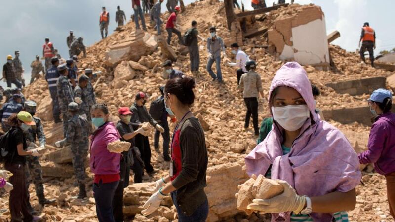 Nepalese civilians and police personnel clear rubble at the Narayan temple in Kathmandu on May 2nd, 2015. Photograph: Menahem Kahanem/AFP