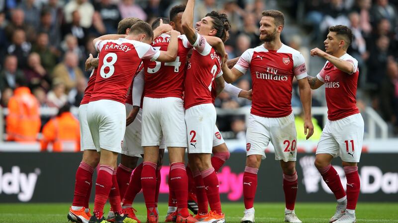 Arsenal celebrate Mesut Özil’s goal which put the Gunners 2-0 up against Newcastle. Photograph: Alex Livesey/Getty)