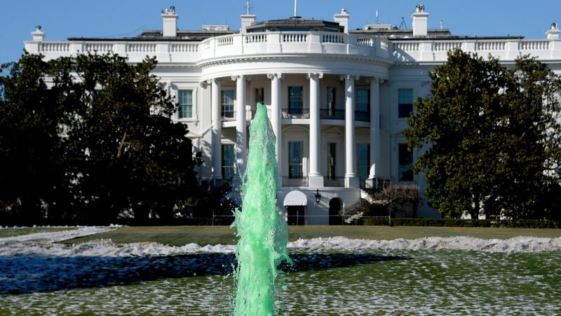 The fountain on the south side of the White House is dyed green for St Patrick’s Day in Washington DC, US. Photograph: Olivier Douliery/EPA