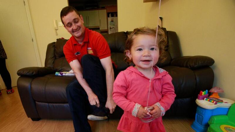 Gordon Sweeney and his daughter Holly, at their house in Clondalkin. Gordon has to walk to work because of the Dublin Bus strike. Photograph: Nick Bradshaw