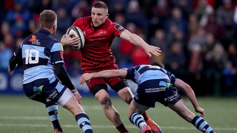 Munster’s Andrew Conway with Gareth Anscombe and Tomos Williams of Cardiff. Photograph: Dan Sheridan/Inpho