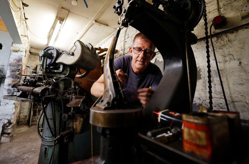 John Miley with a Blake sole Stitcher, left, and a Rapid hot wax Stitcher, right, which were used to repair the shoes of Eamon de Valera when he was taoiseach in 1937. The machines are being donated to the Moynalty Steam Threshing Museum in Co Meath. Photograph: Alan Betson 