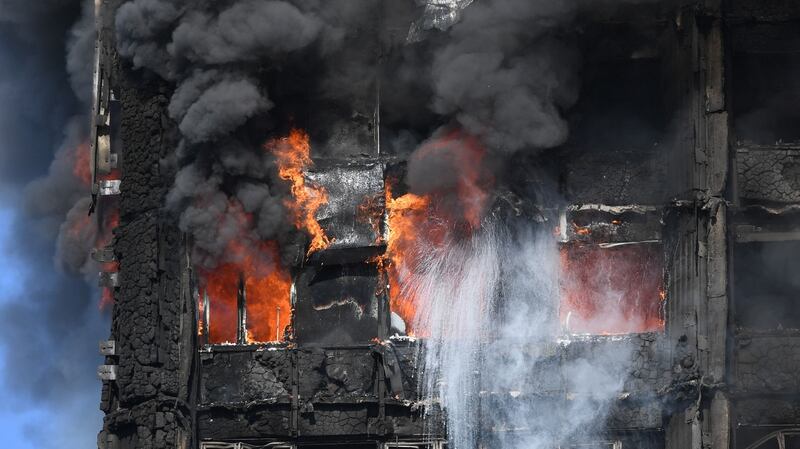 Smoke billows from a fire that has engulfed the 24-storey Grenfell Tower in west London. Photograph: Victoria Jones/PA Wire