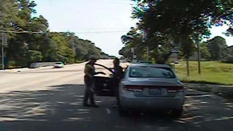 A screengrab showing a Texas state trooper pointing a Taser as he orders Sandra Bland out of her vehicle captured from the police dash camera video. Photograph: Reuters