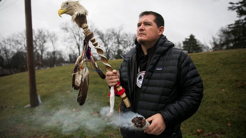 Ray St Clair, from Michigan, who is from the Chippewa Tribe, prays this week outside  Covington Catholic High School in Park Hills, Kentucky, US. Photograph: Madalyn McGarvey/Reuters