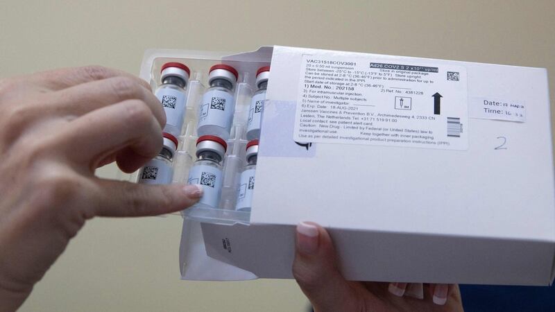 A healthcare worker holds vials containing doses of the Johnson & Johnson Covid-19 vaccine. Photograph: Phill Magakoe/AFP via Getty Images