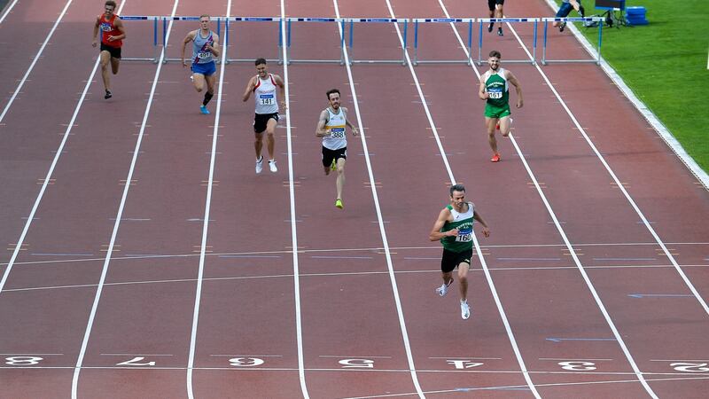 Barr crosses the line to win the 400m hurdles. Photo: Sam Barnes/Sportsfile