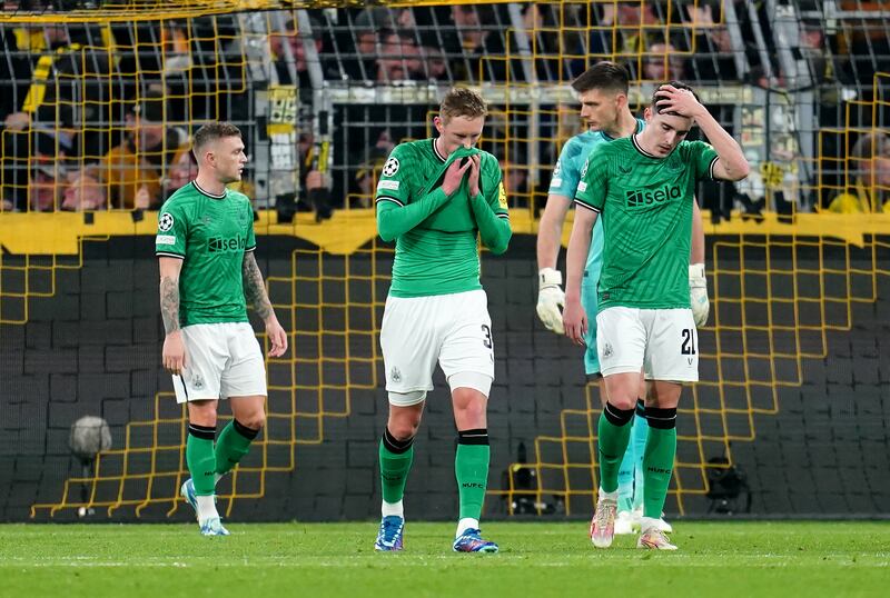 Newcastle United players dejected following Borussia Dortmund's first goal. Photograph: Nick Potts/PA Wire