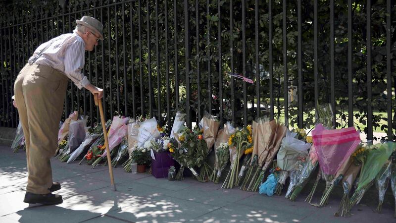 A man looks at flowers laid at the spot in Russell Square where Darlene Horton died following a knife attack, in central London. Photograph: Neil Hall/Reuters