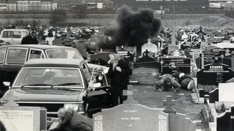 Mourners take cover in Milltown cemetery in Belfast on March 16th, 1988, as a grenade explodes during Michael Stone’s attack on the funeral of three IRA members. Photograph: Paddy Whelan