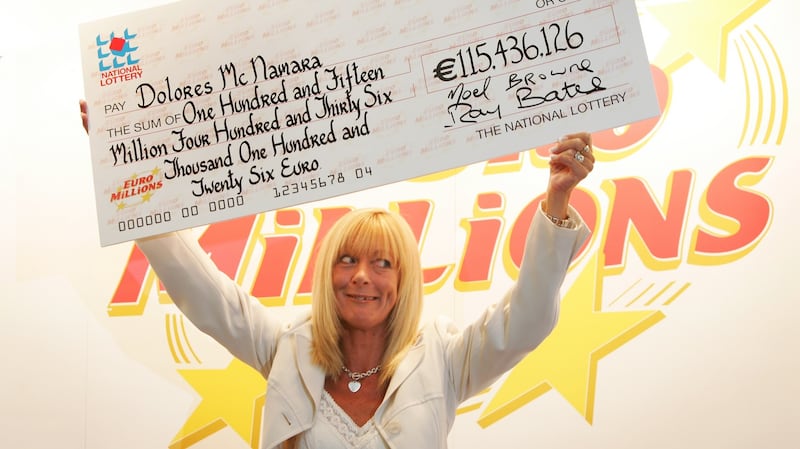 Euromillions winner Dolores McNamara, from Limerick collects a cheque for over €115  million at the National Lottery offices in Dublin. Photograph: Frank Miller