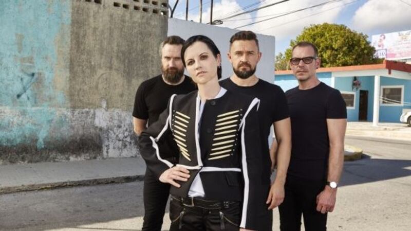 Cranberries lead singer Dolores O’Riordan, guitarist Noel Hogan, bassist Mike Hogan, and drummer Fergal Lawler