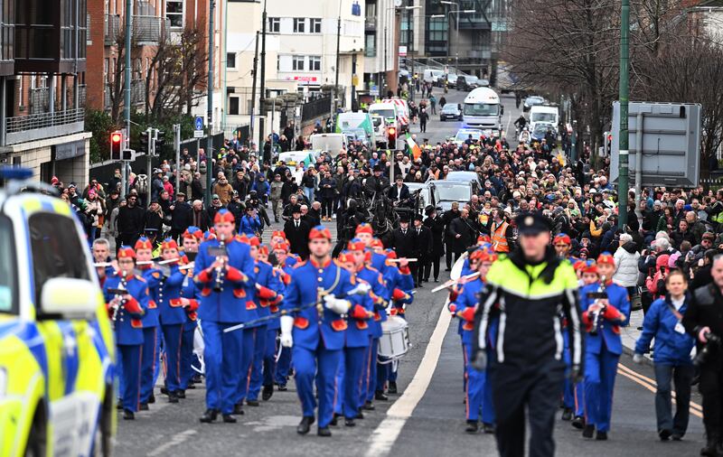 The Artane Band leads the funeral procession for the late singer Shane MacGowan in Dublin city centre on Friday. Photograph: Charles McQuillan/Getty Images