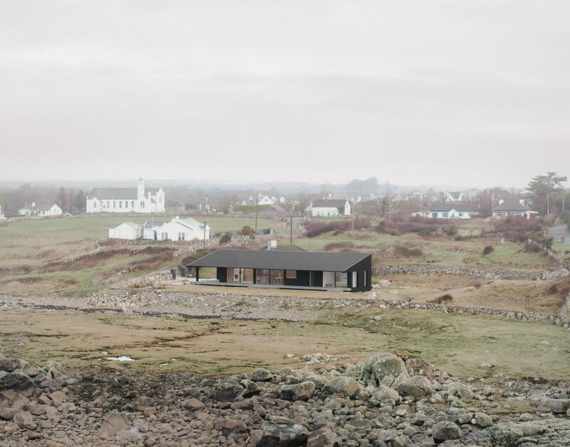 The cottage is surrounded by drystone walls