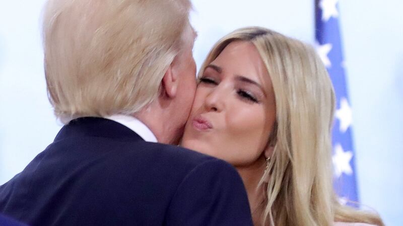 U.S. President Donald Trump kisses his daughter Ivanka at the Women’s Entrepreneurship Finance event during the G20 leaders summit in Hamburg, Germany July 8, 2017.  REUTERS/Michael Kappeler, Pool