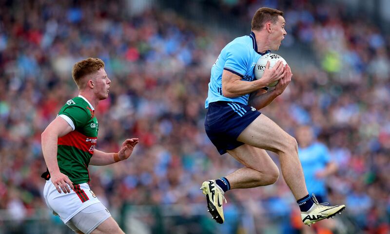 Dublin’s Con O’Callaghan and David McBrien of Mayo. Photograph: Ryan Byrne/Inpho