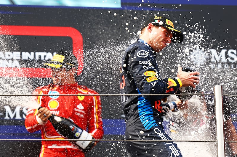 Max Verstappen celebrates on the podium after winning the Emilia-Romagna Grand Prix in Imola, Italy. Photograph: Mark Thompson/Getty Images