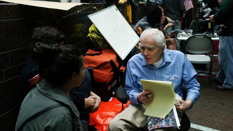 Jimmy Breslin conducts an interview during the Occupy Wall Street protest in Zuccotti Park in New York, October 14th, 2011.  Photograph: Ozier Muhammad/The New York Times