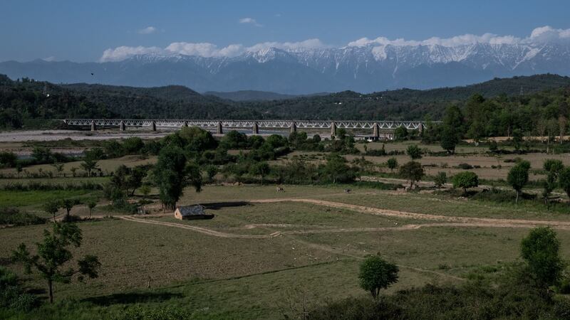 A narrow-gauge railway line crosses a river in the Kangra Valley in Himachal Pradesh, India. Photograph: Rebecca Conway/The New York Times