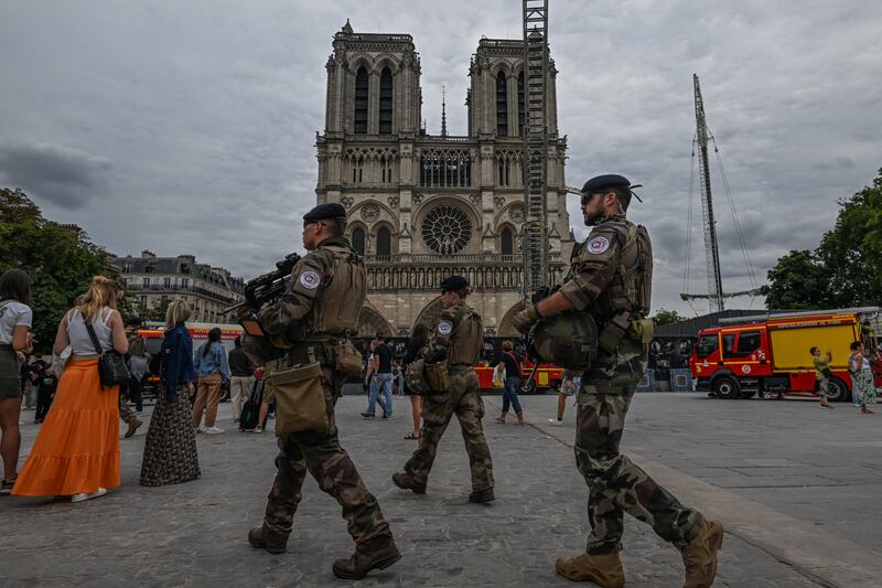 The French military outside Notre Dame Cathedral. The government has spent more than €1 billion on security and policing in an effort to protect the Olympic Games. Photograph: Artur Widak/NurPhoto via Getty Images