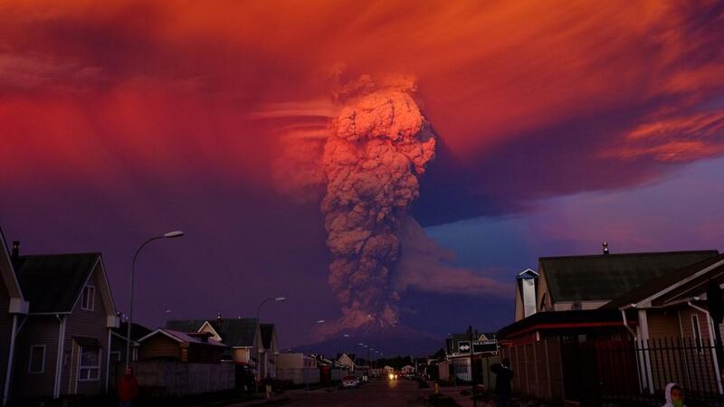 Chile’s Calbuco volcano photographed from Puerto Montt. Due to the eruption of the volcano with a smoke column 20 km high, authorities declared a red alert and ordered the evacuation of 1,500 inhabitants of Ensenada, Alerce, Colonia Río Sur and Correntoso towns. Photograph: Alex Vidal Brecas/EPA