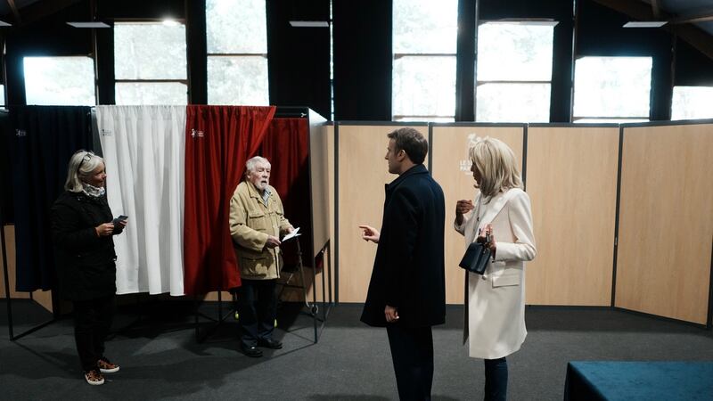 French president Emmanuel Macron, and his wife Brigitte Macron arrive to vote for the first round of the presidential election, in Le Touquet, northern France. Photograph: Thibault Camus/EPA