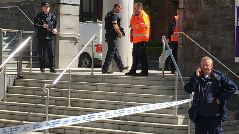 Gardaí and Irish Rail staff at a blocked entrance to Connolly train station on Monday afternoon. Photograph: Peter Murtagh
