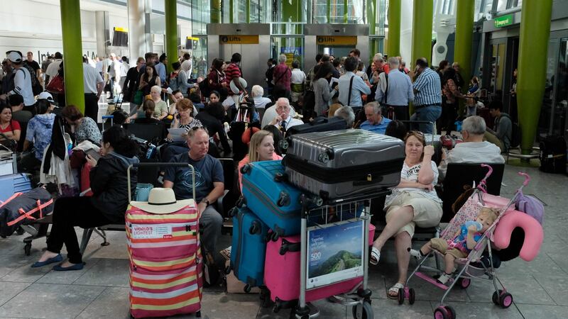 Stranded: travellers wait at terminal 5 at Heathrow Airport after British Airways cancelled all its flights. Photograph: Daniel Leal-Olivas/AFP/Getty