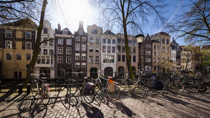 Bicycles parked in front of historic houses along the Oudegracht (Old Canal) in Utrecht