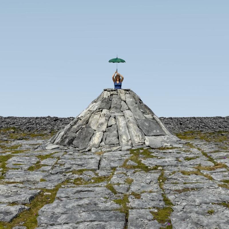 Bríd Ní Neachtain on Winnie’s mound at Creig an Staic on Inis Oírr, the set of Happy Days by  Company SJ and the Abbey Theatre. Photograph: Cormac Coyne