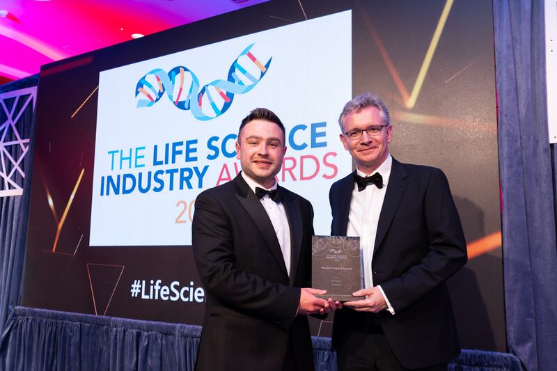 Ben Molloy, entries lead at BusinessRiver, presents the product impact award to John Weldon, Deciphex