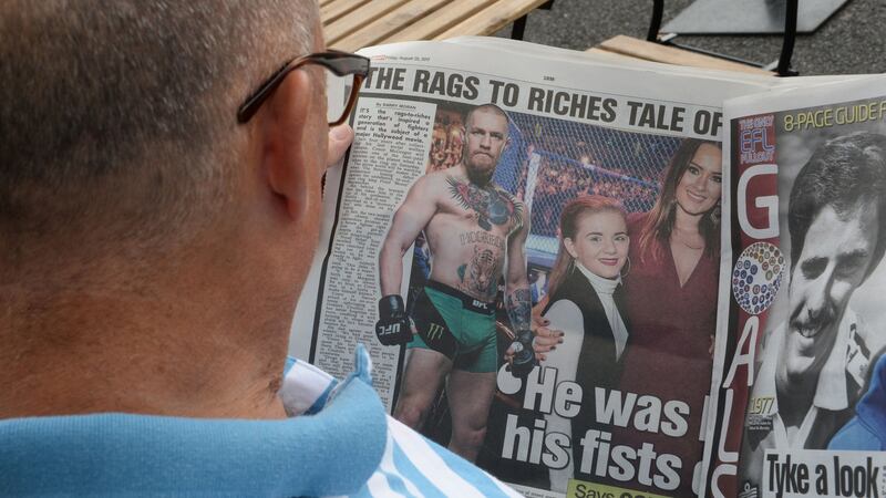 A local reads the headlines. Photograph: Cyril Byrne