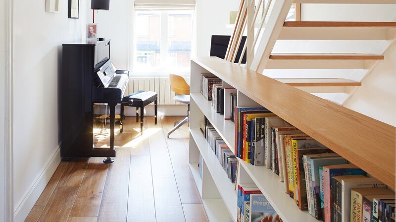 The landing  has space for a piano and bookshelves.