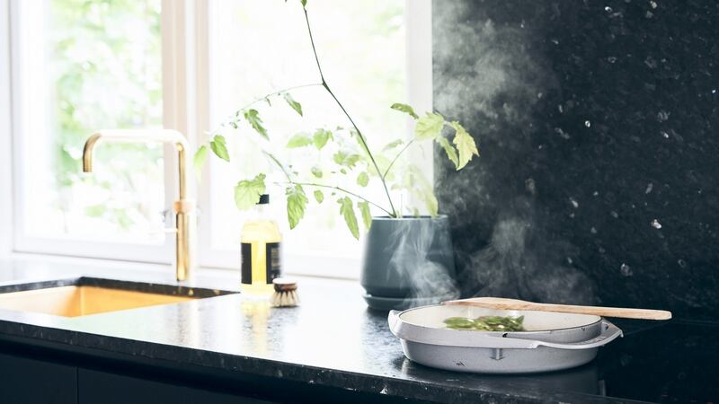 Lundhs Real Stone’s  Emerald, an inky green in a silk finish,  is used on the countertop and splashbacks.